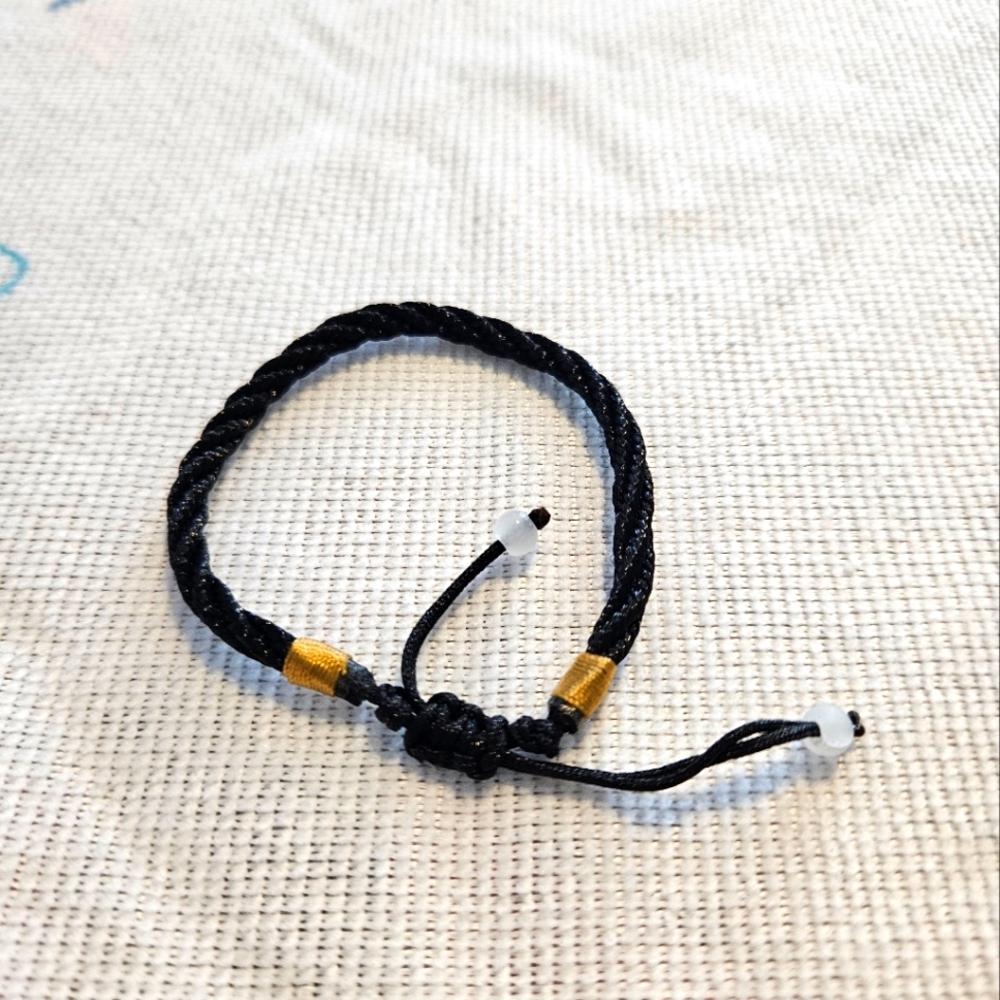 Black string bracelet
